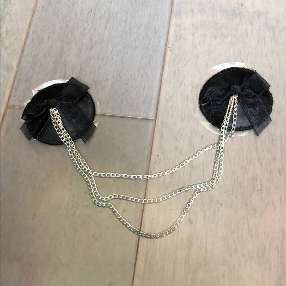 NWOT black pasties with chain & ribbon detail.